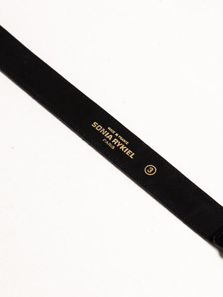 Black Sonia Rykiel suede leather belt with rhinestone embellishment of city names.