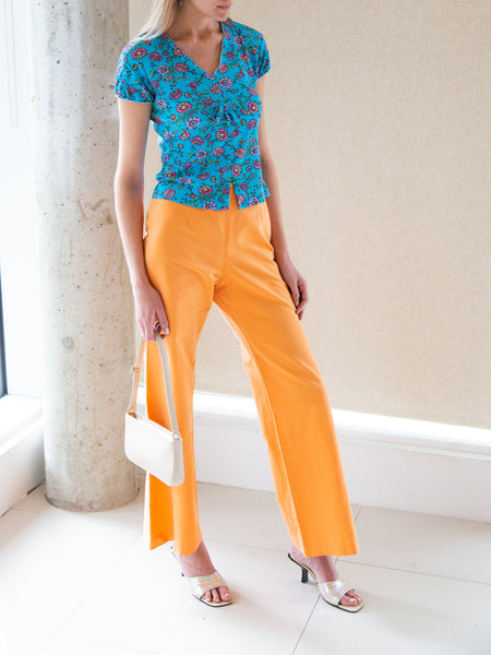 Vintage 2000s tangerine flared trousers by Laurèl of the Escada family.