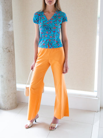 Vintage 2000s tangerine flared trousers by Laurèl of the Escada family.