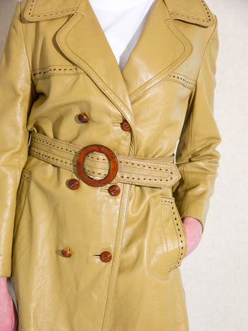 Vintage 1970s tan leather belted trench jacket with wooden buckle and buttons