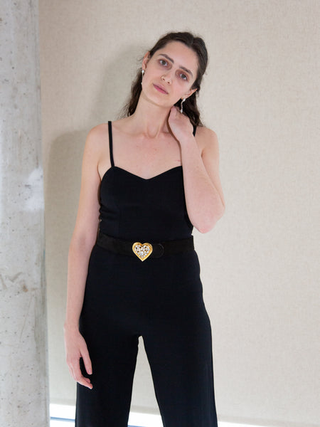 Woman wearing vintage 1990s black sleeveless jumpsuit by Synonyme de Georges Rech