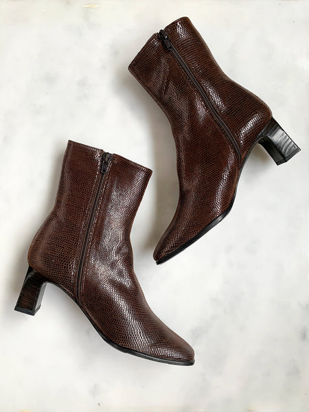 A pair of dark brown vintage 1990s ankle boots in mint unworn condition made from lizard effect leather