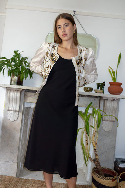 Model wears vintage ivory silk embellished beaded evening jacket
