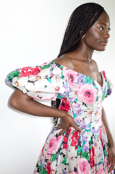 Model wears vintage 1980s Victor Costa floral print puff sleeve dress