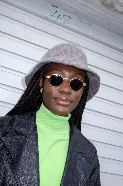 Model wearing vintage 1990s tortoiseshell sunglasses by Morgan de Toi