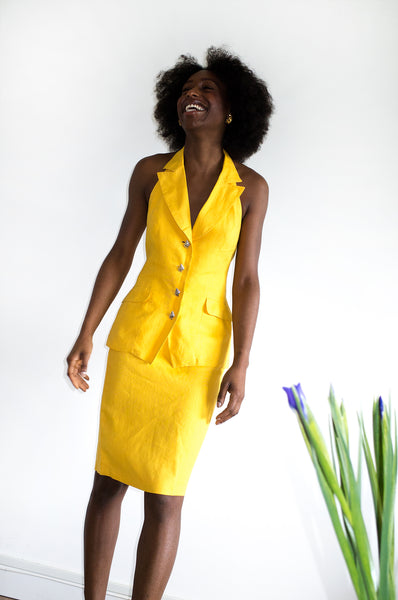 Vintage 1980s yellow designer two-piece with statement button detail