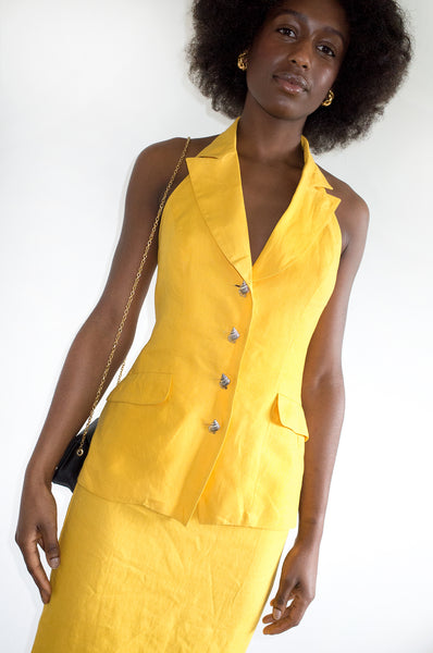 Vintage 1980s yellow designer two-piece with statement button detail