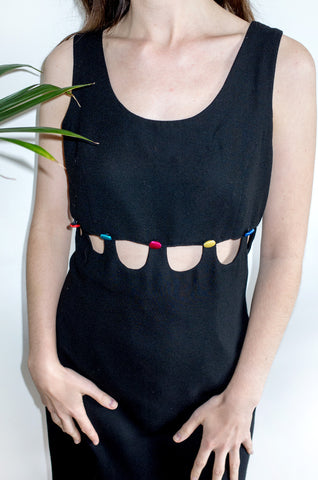 An unusual vintage 1990s black sleeveless shift dress with multicoloured buttons and cutaway detailing