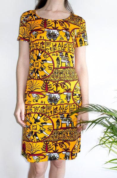 A rare vintage 1970s T-shirt dress featuring a novelty Egyptian hieroglyphics-inspired print.