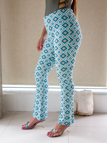 Model wearing vintage Y2K geometric-print flared trousers with elasticated waist