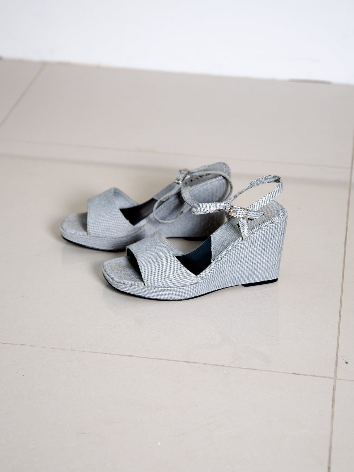A pair of vintage 1990s light-blue wedge sandals