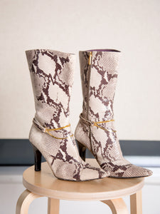 A rare pair of vintage Y2K snake-print calf-length boots with detachable ankle chains.