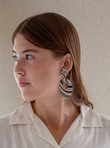 Vintage oversized white and black hand-painted marbled-effect wooden earrings.
