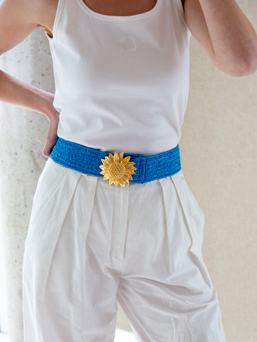 Vintage 1980s bright blue waist belt with statement gold sunflower buckle.